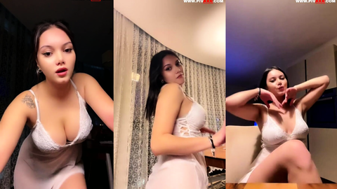 tango bloom transparan gecelikle memelerini gösterip poz veriyor