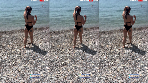 caramelgirl plajda siyah tangasıyla kalçasını sergileyerek yürüyor