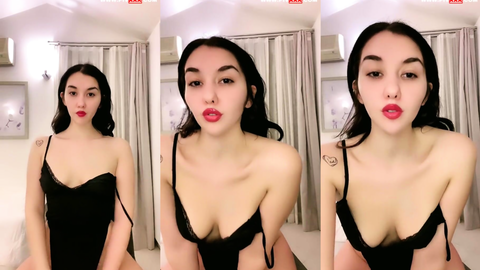 tango aymila siyah bodysuitle memelerini açıp poz veriyor